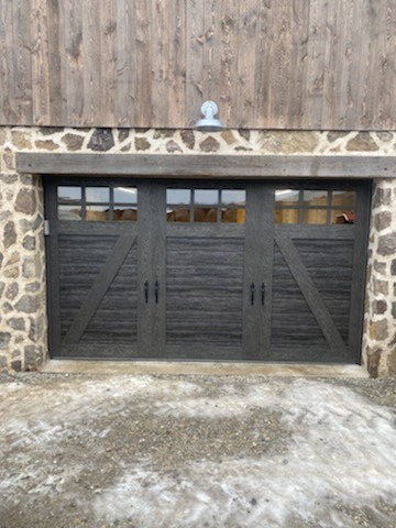 brown wood garage door with windows