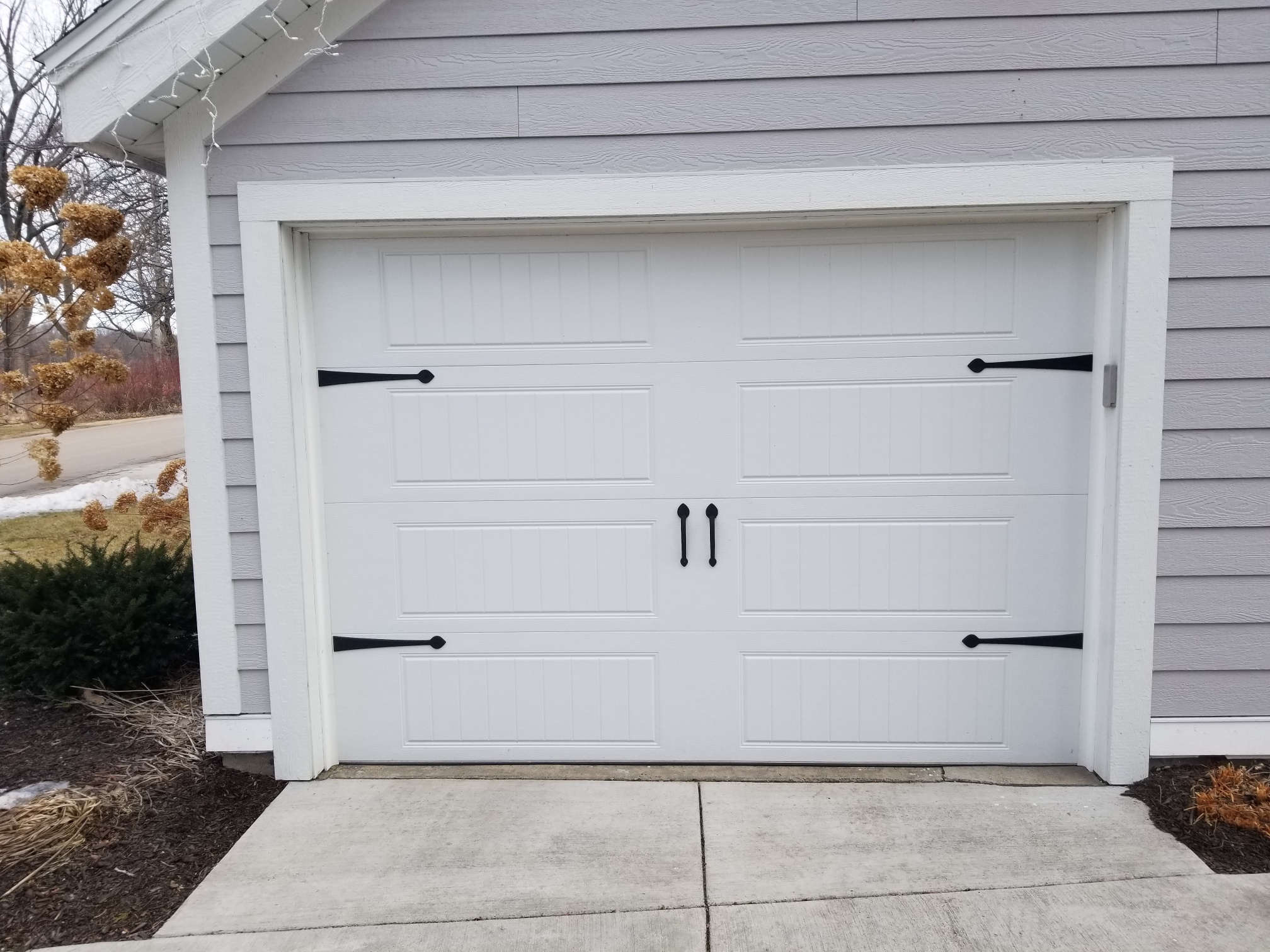 residential white garage door with handles
